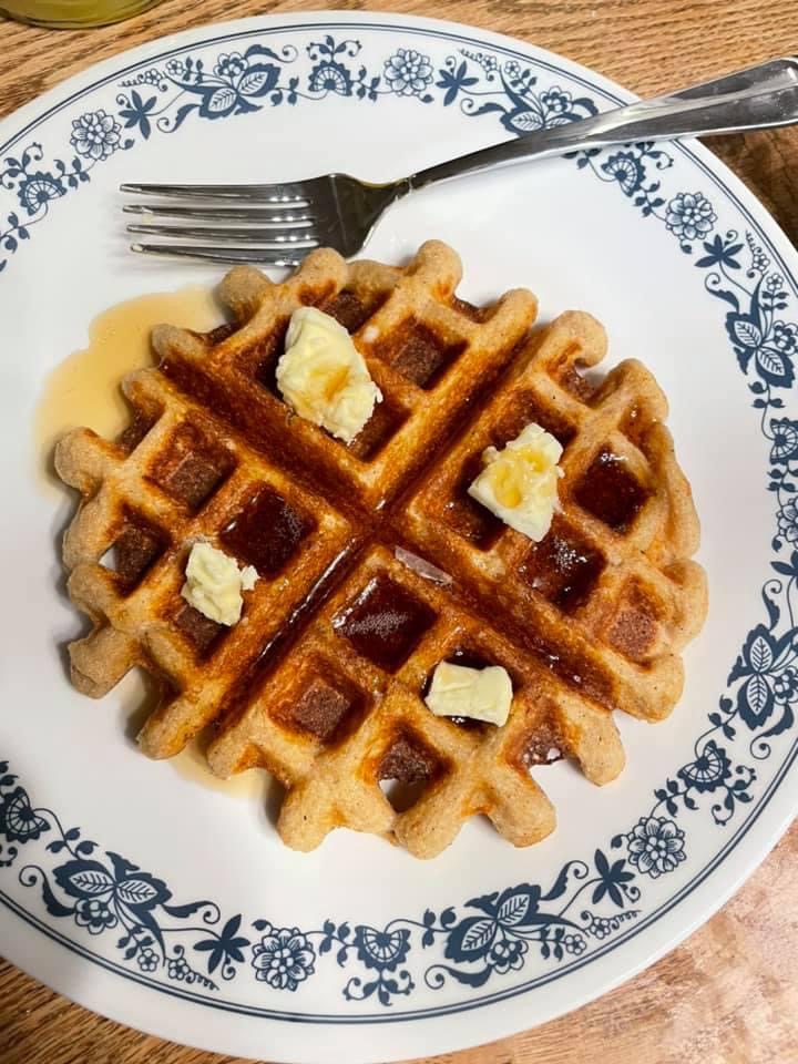 A fresh, hot waffle, made from freshly-milled 100% whole-wheat flour, steamy with butter and syrup.